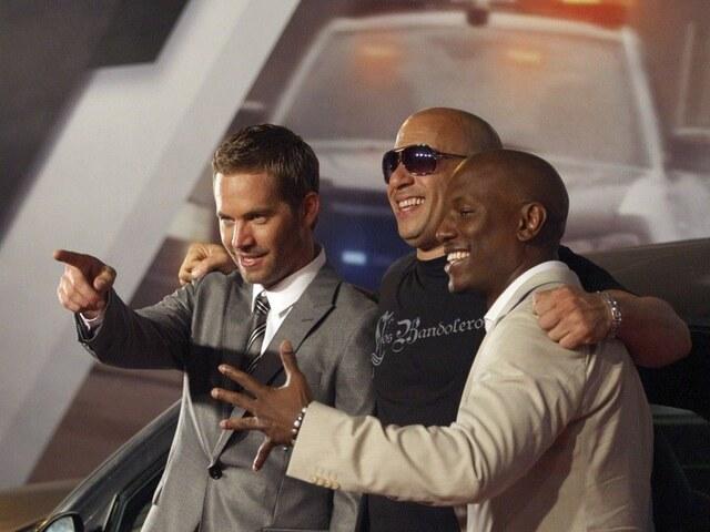 A rare candid moment of Vin Diesel sharing laughs with Paul Walker and Tyrese Gibson—reminding us of the bond that fuels this legendary franchise.