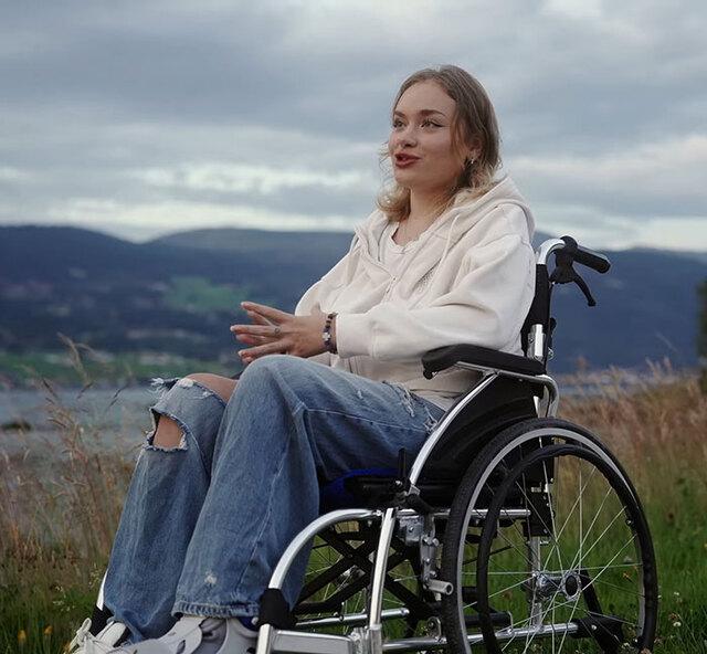 Even in a wheelchair, Maria’s spirit remains unshaken, inspiring others with her grit.