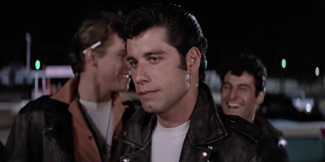John Travolta’s Danny Zuko is the perfect mix of charm and vulnerability — a leader of the T-Birds who hides a softer side beneath his leather jacket and slicked-back hair.