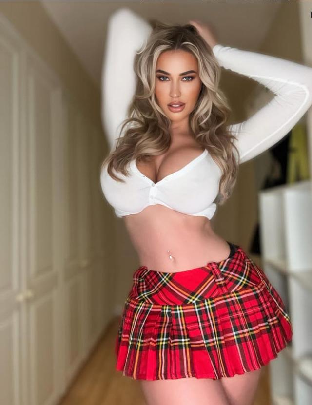 Sophie's stunning gaze and flawless figure are on full display, capturing the essence of her empowering and captivating presence.