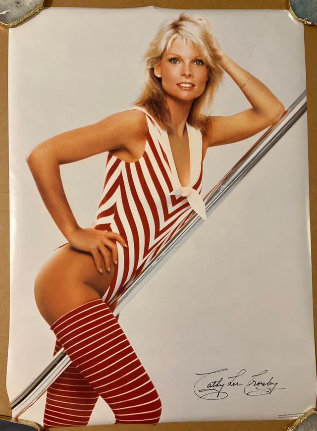 A bold and vibrant Cathy Lee Crosby in a candy-striped bodysuit, capturing the vibrant energy of late-’70s pop culture.