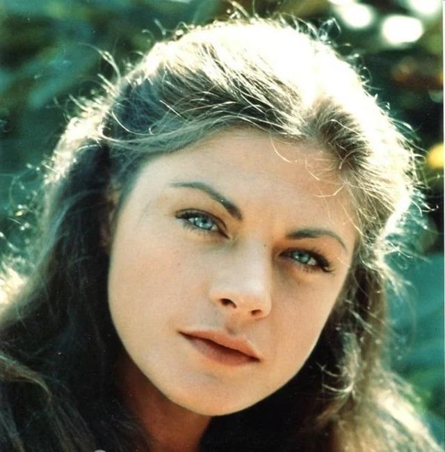 A candid youthful shot of Meg Foster, capturing her timeless beauty and unique aura.