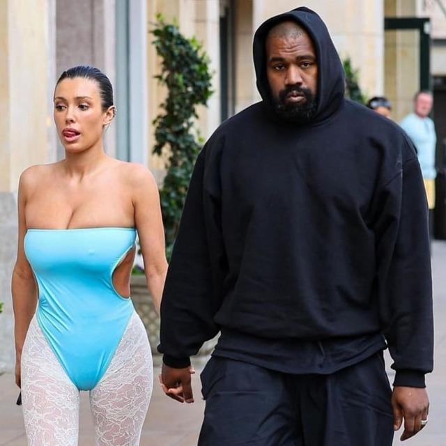 Bianca Censori turns heads in a bold street-style look while walking with Kanye West, reaffirming her distinctive fashion sense.