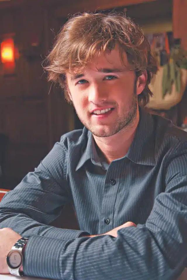 Haley Joel Osment as a young adult, embracing a more mature look and new career phase.