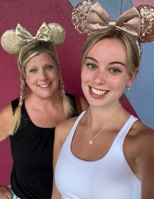 Mother and daughter, Diane and Sarah, wearing Minnie Mouse headbands during a family vacation.