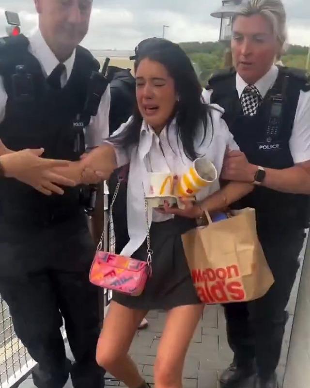 Tears, shouting, and a bag of food still in her hands – a chaotic moment as the teenager is escorted out of the restaurant.