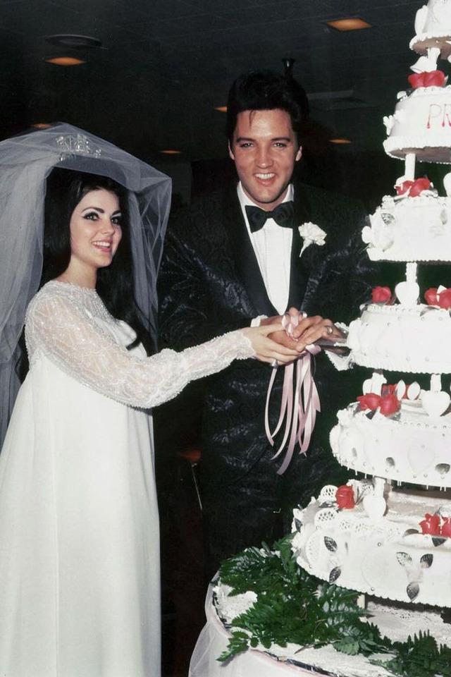 A joyous moment from the wedding of Priscilla and Elvis Presley, marking the beginning of a marriage that would captivate the world.