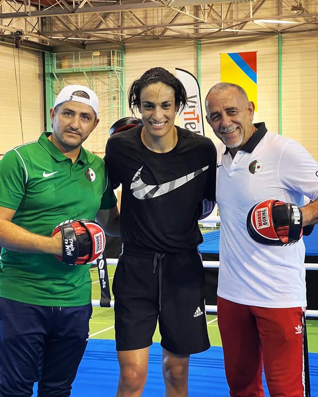 Back in training mode: Khelif with her coaches, ready to silence critics with her resilience in the ring.