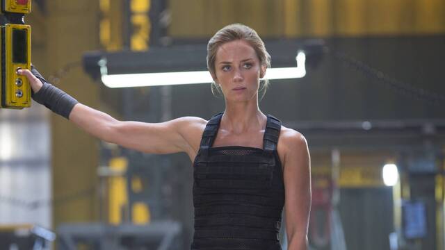 Emily Blunt in Edge of Tomorrow (2014), embodying a strong, action-packed character, fully equipped for a thrilling battle in a futuristic world.