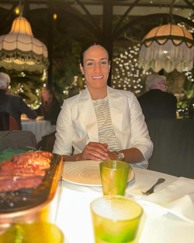 Imane Khelif enjoying a quiet evening dinner, radiating elegance far from the boxing ring.