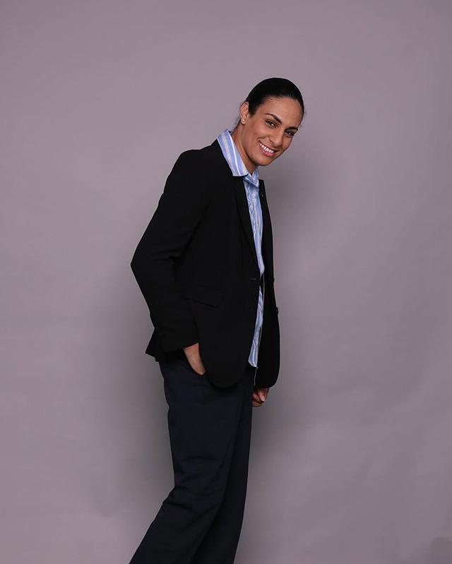 Khelif suits up with confidence, proving that strength and elegance can go hand in hand.