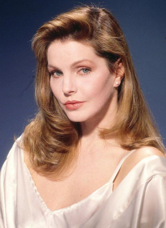 Priscilla Presley in the 1980s, effortlessly blending elegance with a bold, modern look—capturing the essence of beauty and strength in one frame.