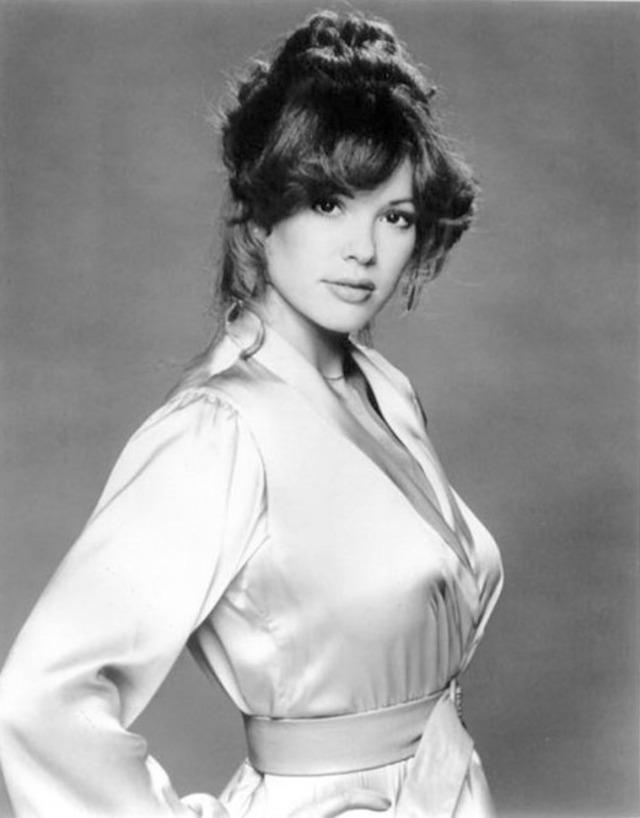 A classic, elegant portrait of Candy Loving, showcasing her graceful beauty in a vintage black-and-white style.