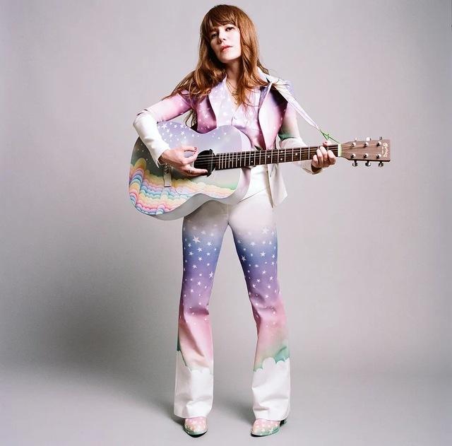 From rainbows to stars—Jenny Lewis rocks her psychedelic style with flair, capturing the true essence of indie rock.