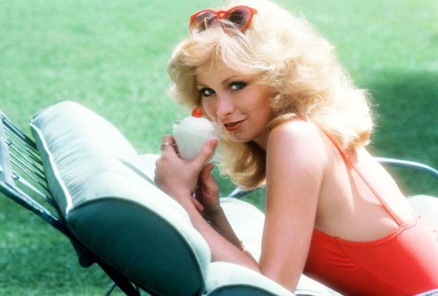 A playful moment captured: Marcy Hanson enjoying a sweet treat in style.