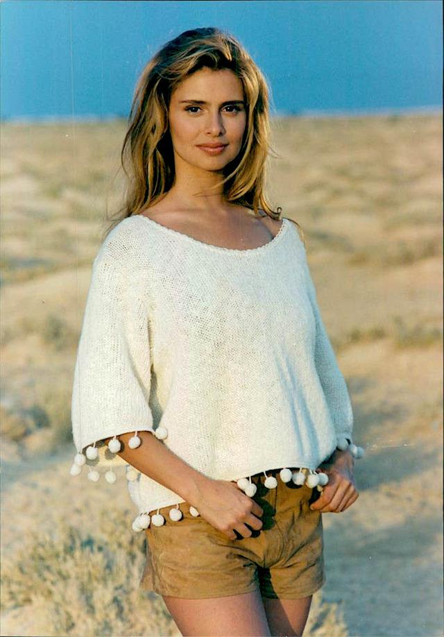 Born and raised amid its canals and cobblestone streets, she grew up surrounded by theatre, music, and cinema 