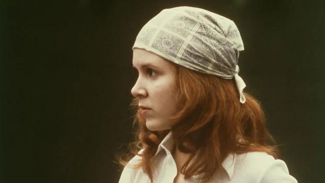 Carrie Fisher in A New Hope, looking fierce as Princess Leia. 