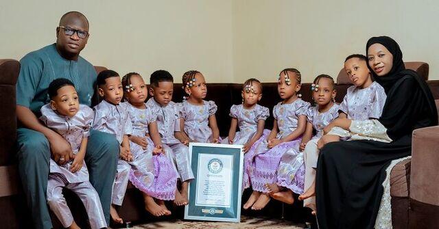 The first surviving nonuplets, beaming with joy, proudly holding their Guinness World Record certificate.