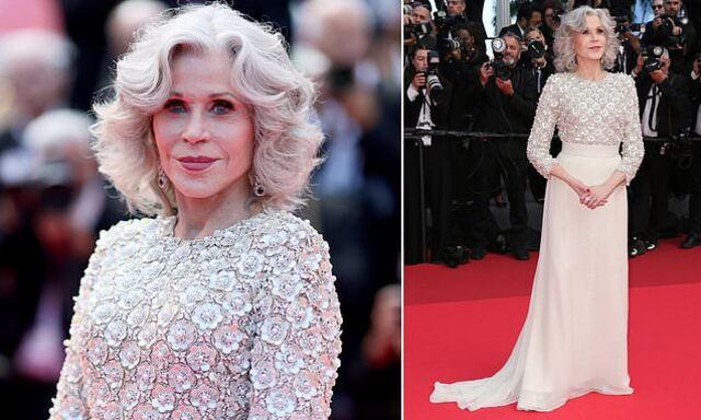 She wore a gown that blended delicate floral patterns with soft chiffon, which draped elegantly around her.