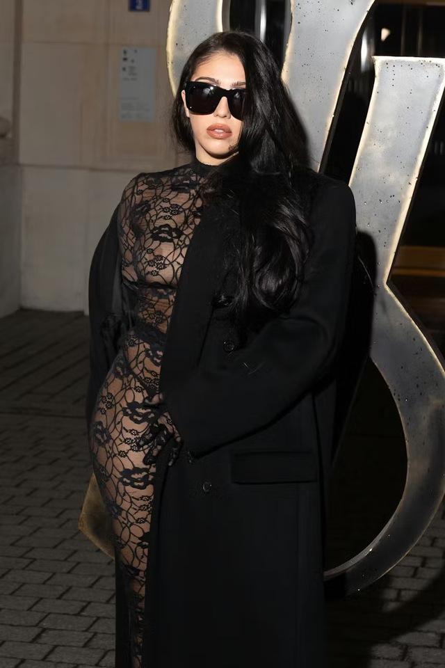 Her appearance in a sheer black lace catsuit at the Saint Laurent Menswear Fall-Winter 2025/2026 show wasn't just about showing skin—it was about stirring the pot.