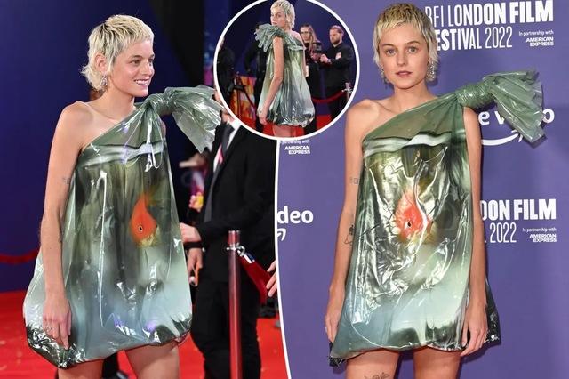 Emma Corrin walked the red carpet in a satirical gown shaped like a goldfish trapped in a plastic bag.