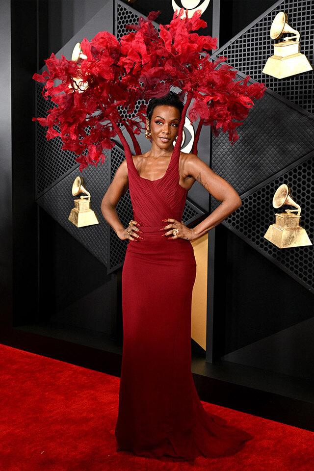 Dawn Richard (2024) represented Mother Nature in a vibrant red gown swallowed by massive sculptural leaves.