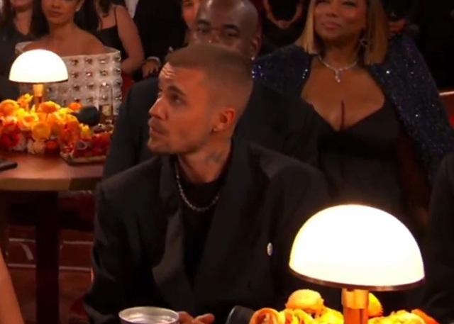 Justin Bieber’s stoic gaze and 'clamped' facial cues, which body language experts interpreted as a sign of setting firm personal boundaries.