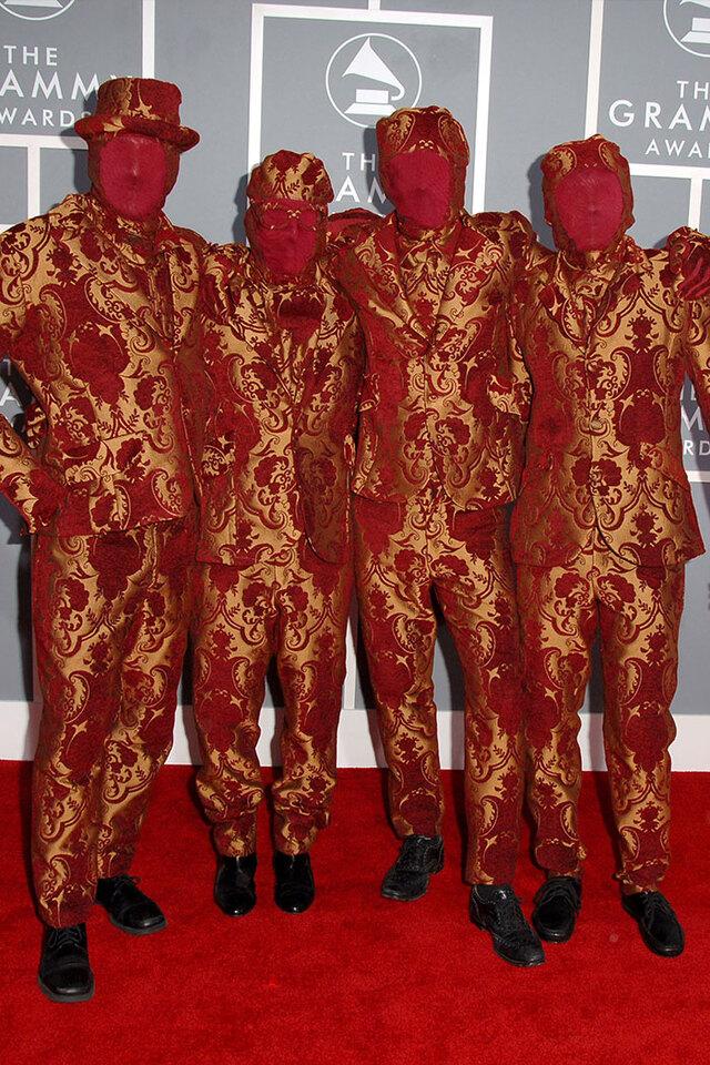 OK Go (2007) obscured their faces with red stockings while wearing impeccably tailored patterned suits.