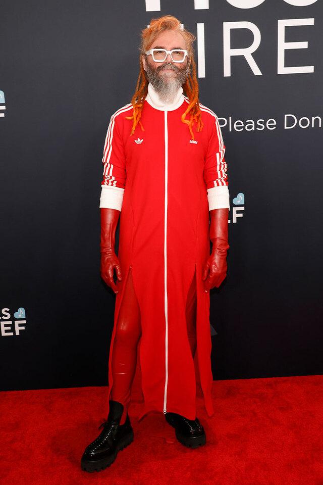 Shawn Everett (2025) chose "unhinged cozy" for the red carpet by wearing a bright red Adidas tracksuit.