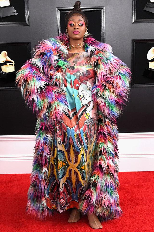Tierra Whack (2019) embraced maximalism in a multi-colored faux fur coat that functioned as a moving kaleidoscope.