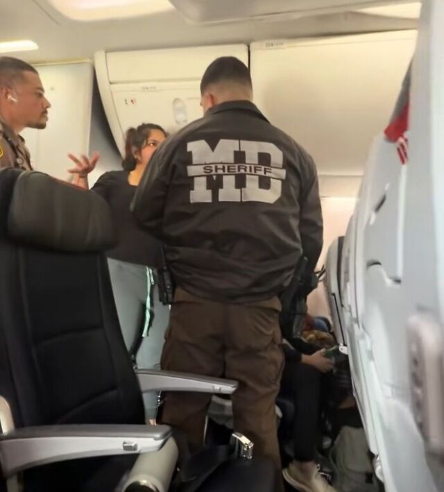Officers board the aircraft to handle the uncooperative traveler.