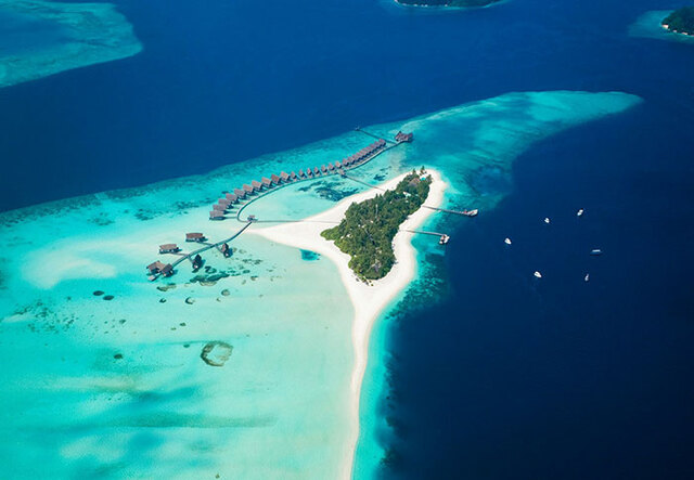 An aerial view of the serene Vaavu Atoll, the site where the scientific expedition turned tragic.