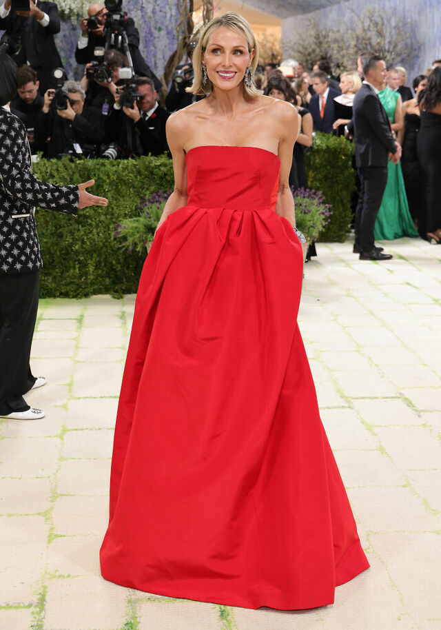 Jamie Alexander Tisch: Bold Calder Red minimalism in a timeless strapless gown.