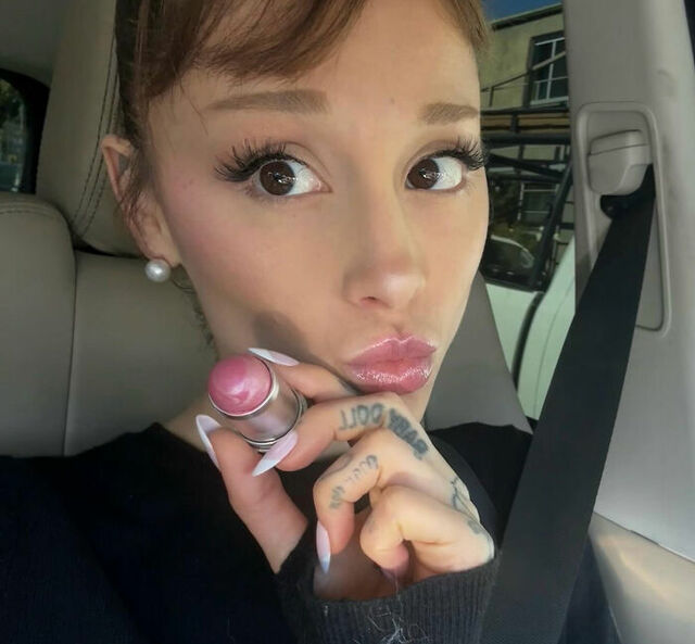 Transitioning from pop stage to movie set, star Ariana Grande applies finishing touches, unaware her role would soon dominate headlines.