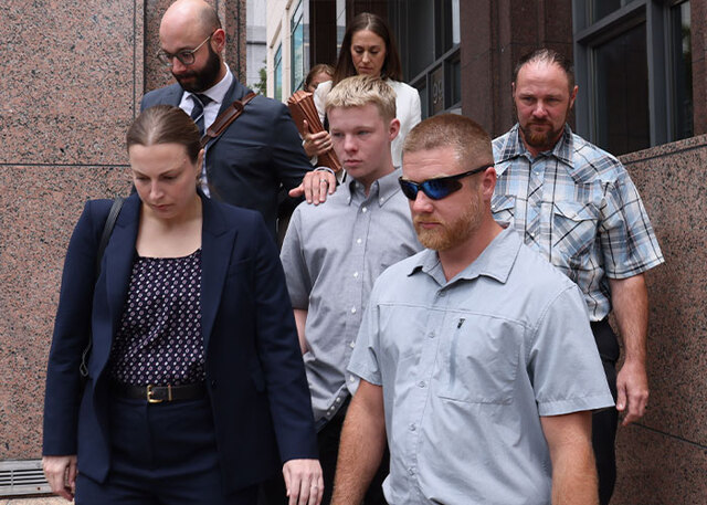 Defense attorney Alejandra Lopez accompanies Timothy Hudson as prosecutors push for immediate pre-trial detention.
