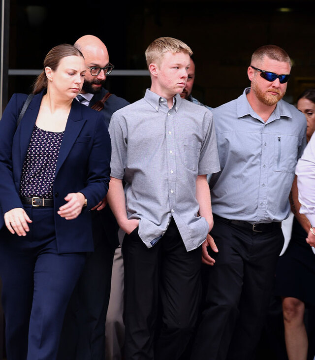 Timothy Hudson, 16, leaves the courthouse surrounded by his legal defense team despite being labeled a community danger.
