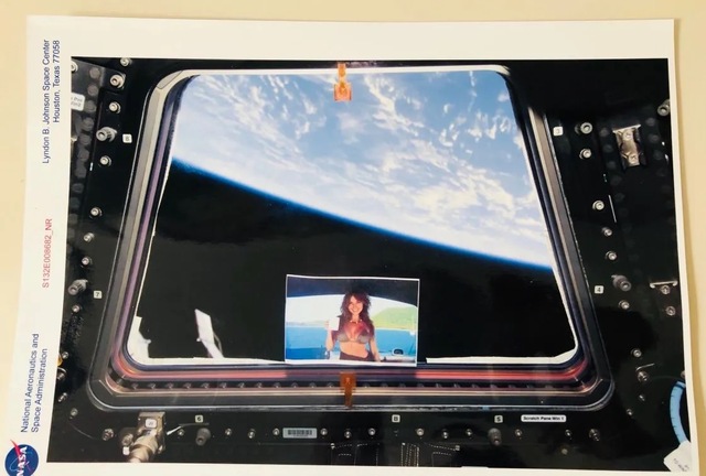 Tucked safely among essential flight gear and scientific equipment, the physical photograph broke through the atmosphere